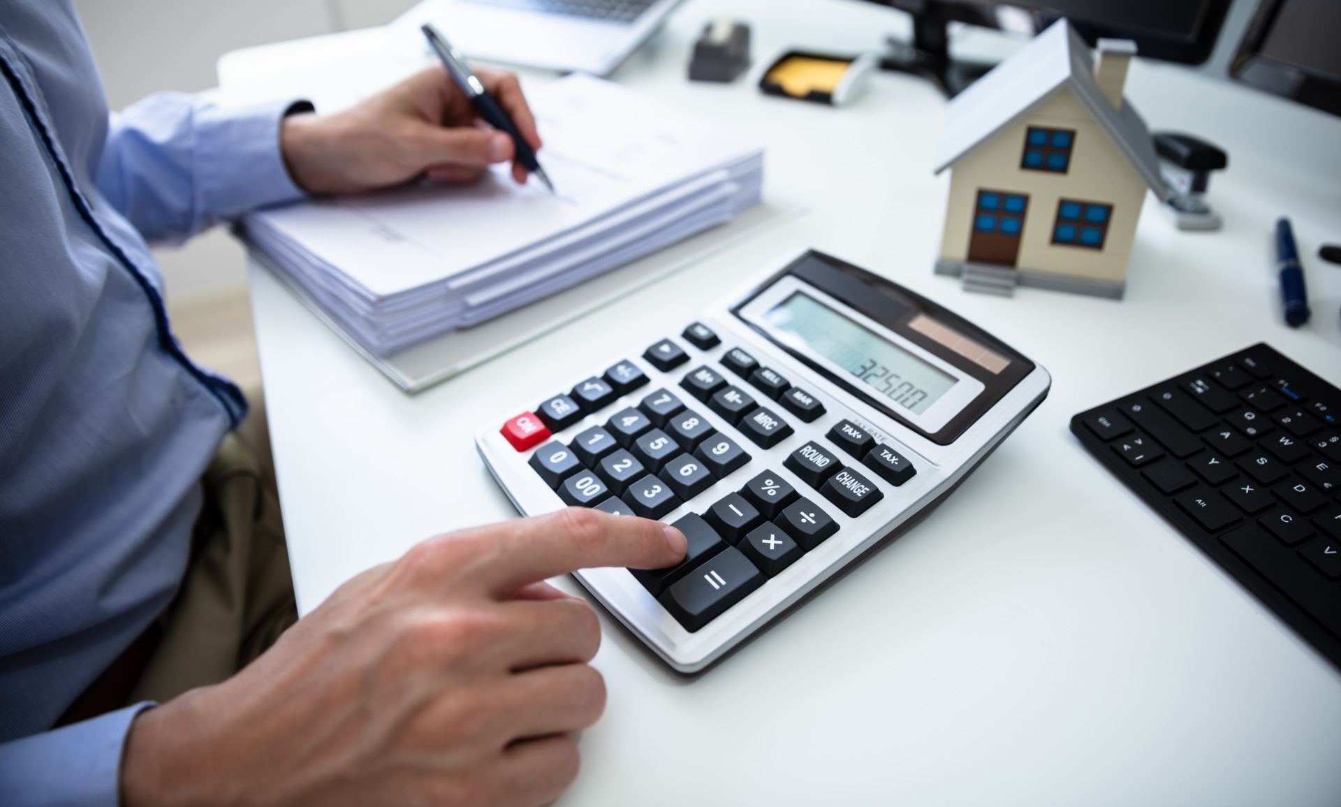 Man using a calculator